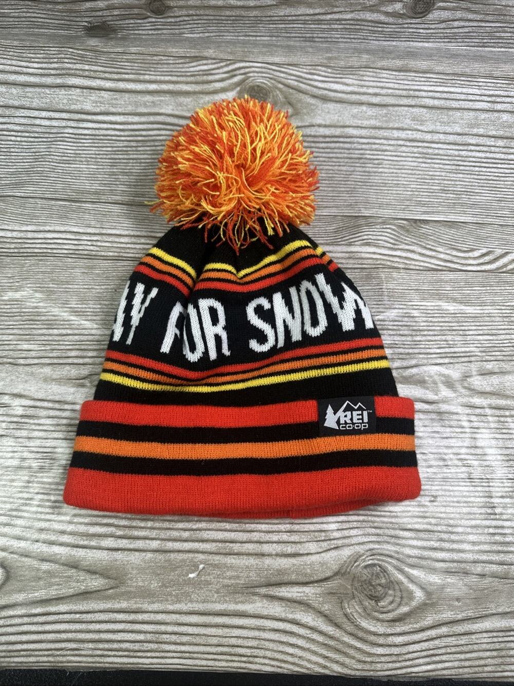 REI CO-OP Adult Pray For Snow Orange Black Pom Pom Winter Beanie Hat Cap Knit